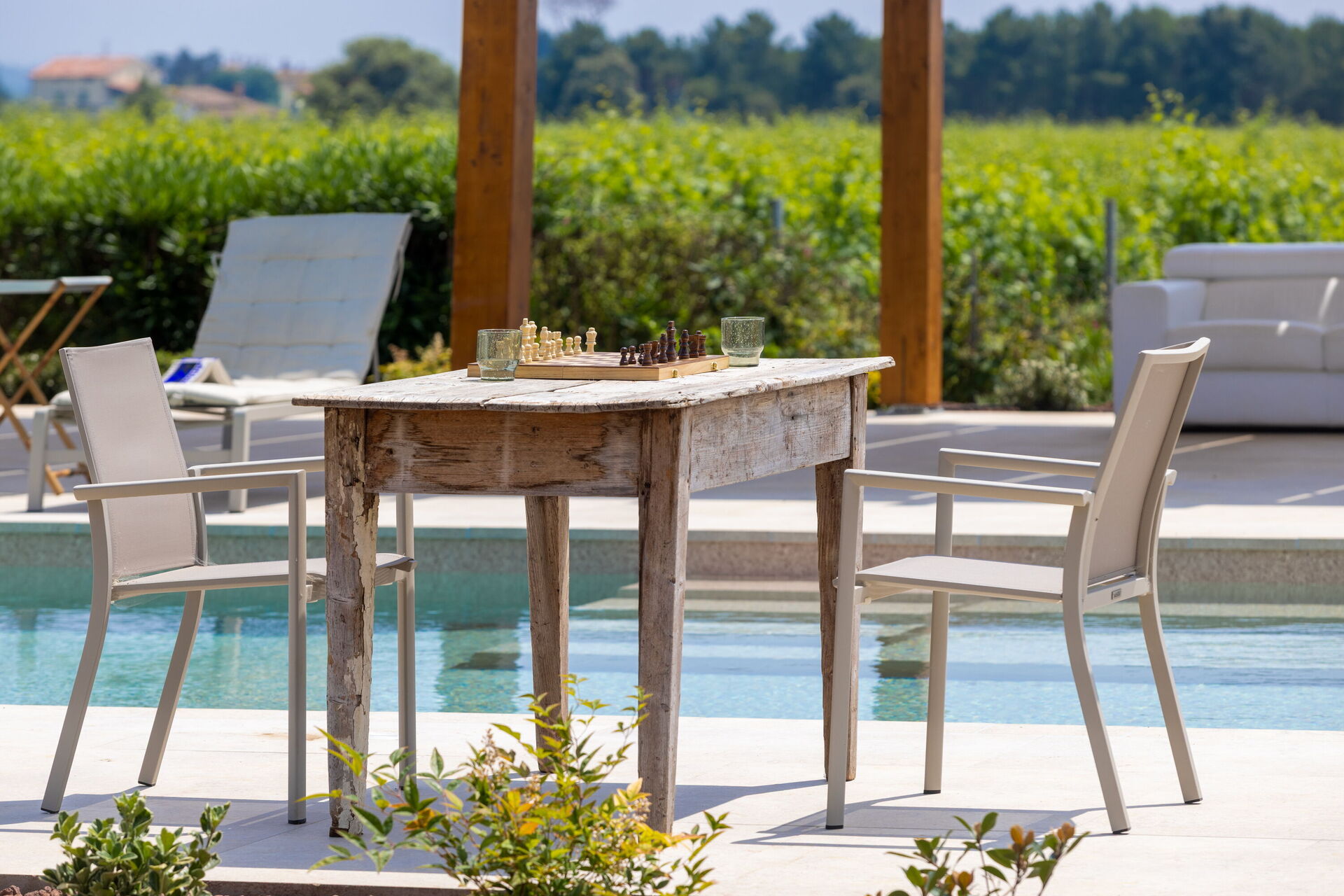 Chess set by the pool